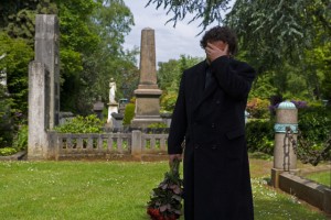 Grieving Man in Cemetery